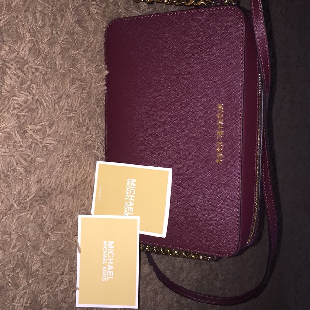 Maroon Micheal Kors crossbody handbag